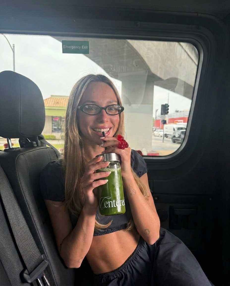 Woman enjoying a centered matcha collagen drink on the go