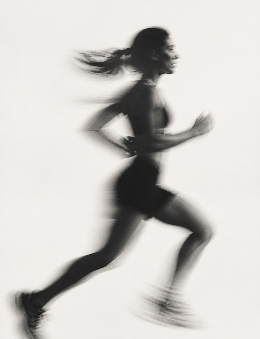 Runner pausing at golden hour